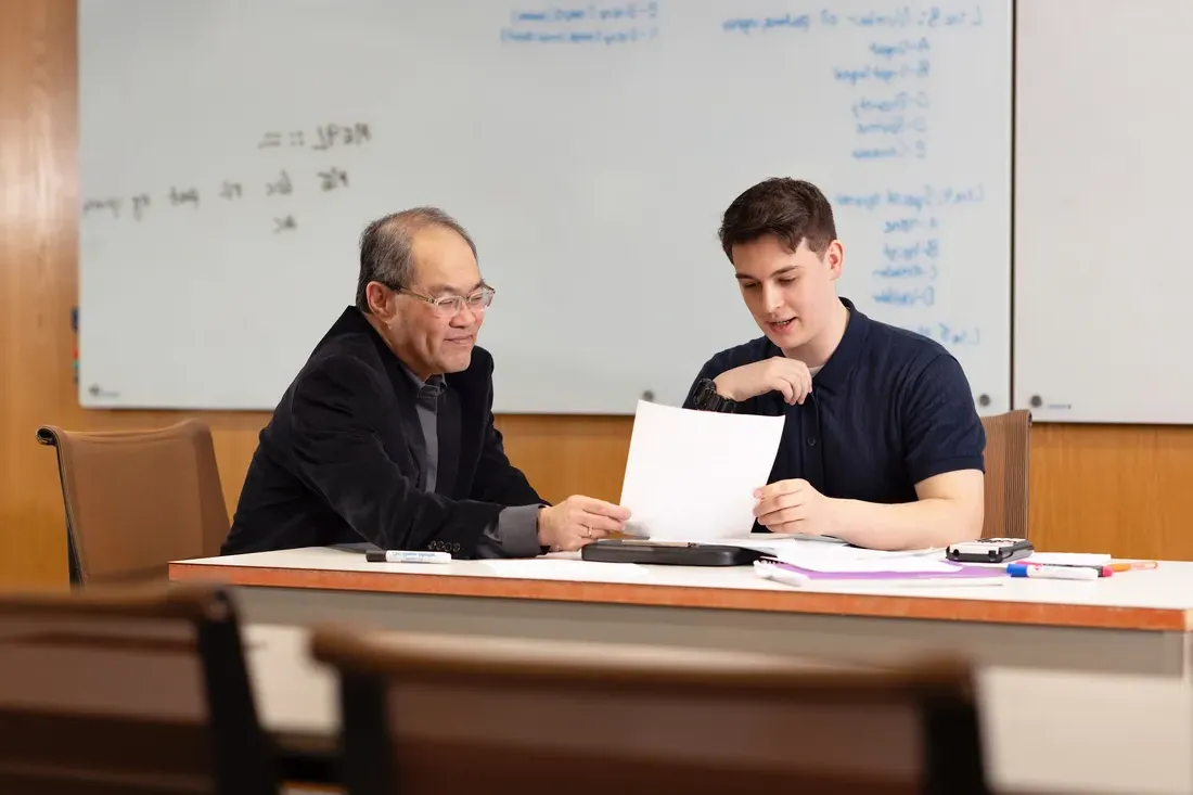 Benjamin Johnson working with Professor Shiu Kai Chin.